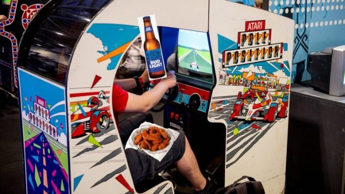 London MCM Comic Con 2019 LONDON, ENGLAND - MAY 24: Gamers playing the retro Atari video game Pole Position during Day 1 of London MCM Comic Con 2019 at ExCel on May 24, 2019 in London, England.(Photo by Ollie Millington/Getty Images)