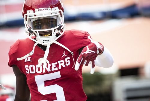 Oklahoma wide receiver Marquise Brown (5) flashes the horns down while taking the field before an NCAA college football game against Texas at the Cotton Bowl in Dallas, Texas, on Saturday, Oct. 6, 2018. [NICK WAGNER/AMERICAN-STATESMAN]